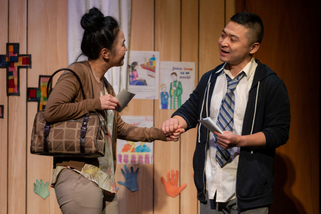 Maki Yi and Howie Lai in Kim’s Convenience, 2022: set design by Carolyn Rapanos; costume design by Jessica Oostergo; lighting design by Jonathan Kim; photo by Moonrider Productions