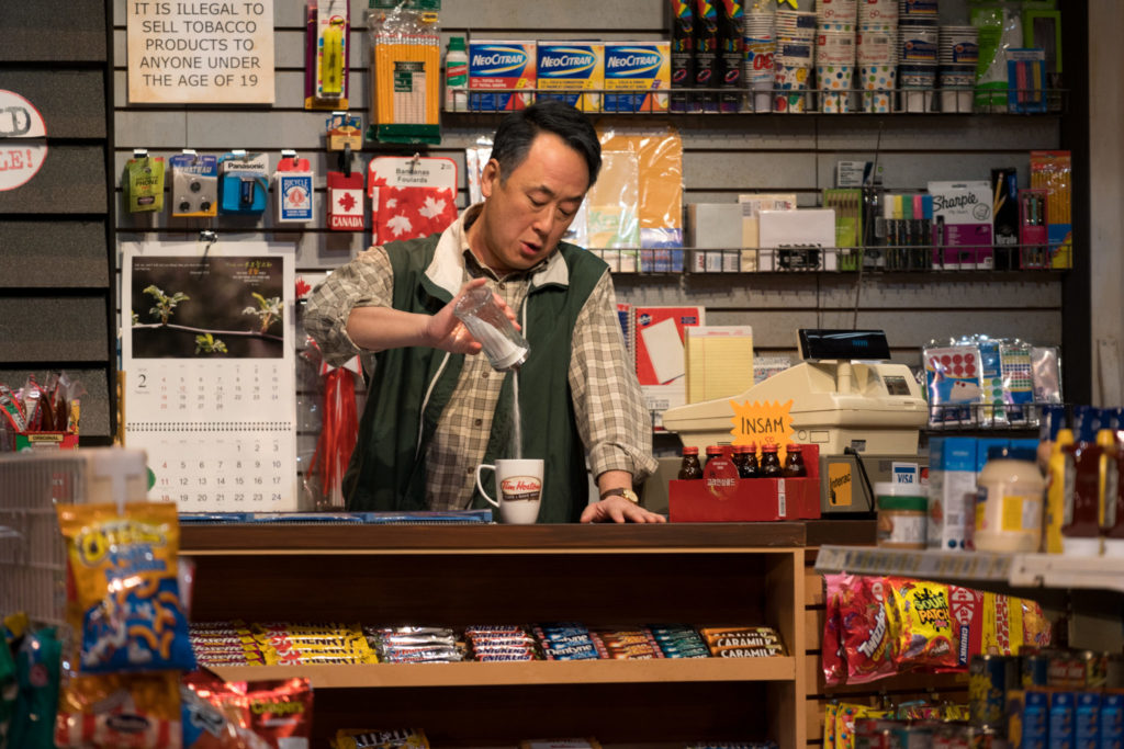 James Yi in Kim’s Convenience, 2022: set design by Carolyn Rapanos; costume design by Jessica Oostergo; lighting design by Jonathan Kim; photo by Moonrider Productions